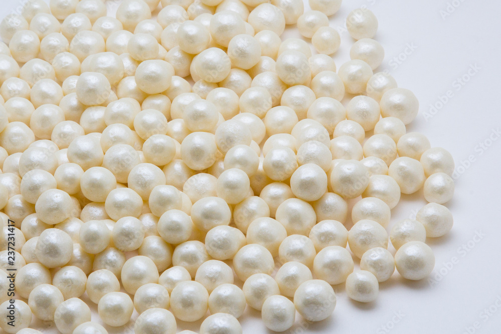Multi-colored pearls on a white background Multi-colored pearls on a white background