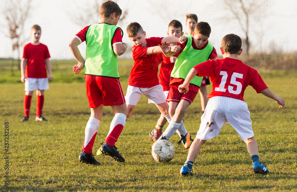 Obraz premium Young children players on the football match