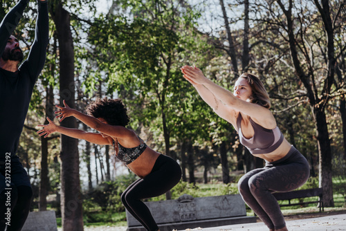 Group of people who practice yoga in the park