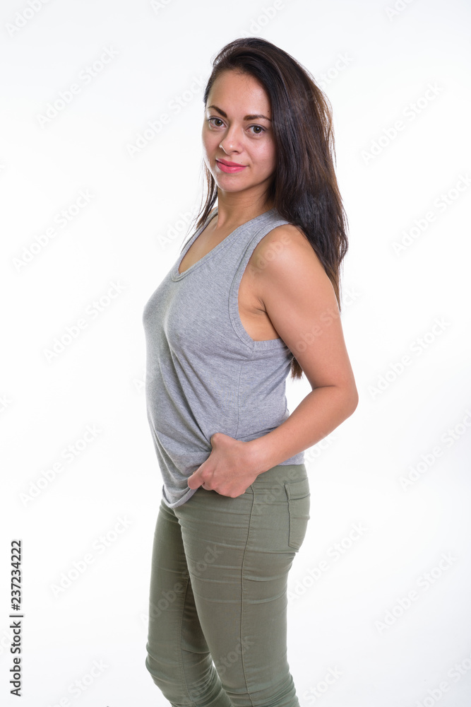 Portrait of beautiful woman standing against white background Portrait of beautiful woman standing against white background