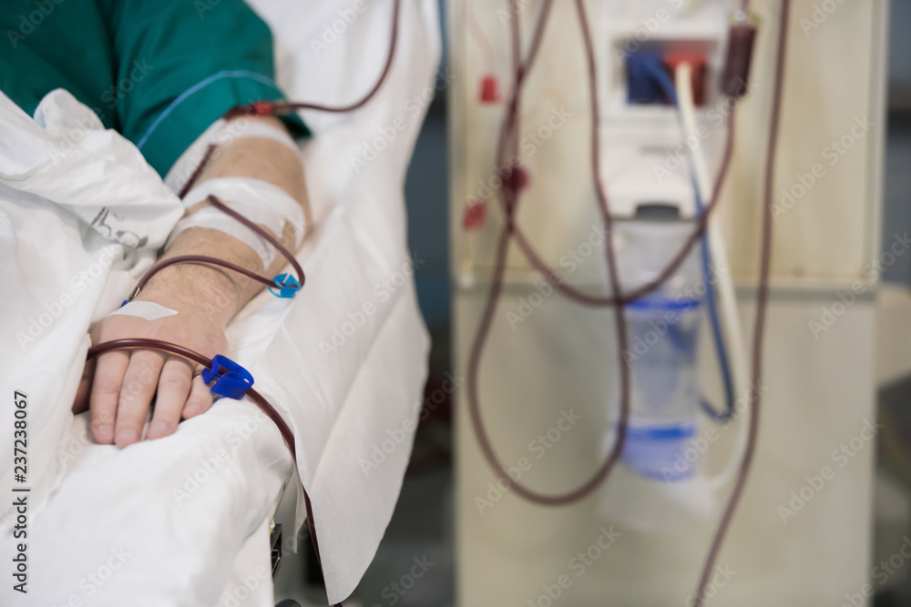 Patient getting blood transfusion in hospital clinic Patient getting blood transfusion in hospital clinic