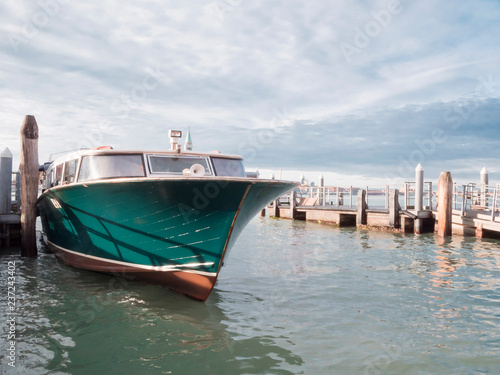 VENICE  ITALY  NOV 1st 2018  Bright boat parked near the sea shore. Classic Venezia or Venice colorful cityscape