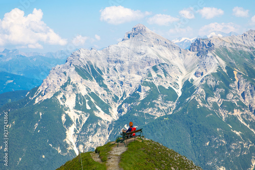 Valley in the Alps (Austria, Europe). Beautiful nature, high mountains, summer day, snowy peaks. Hike in the rocks, traveling with a backpack.