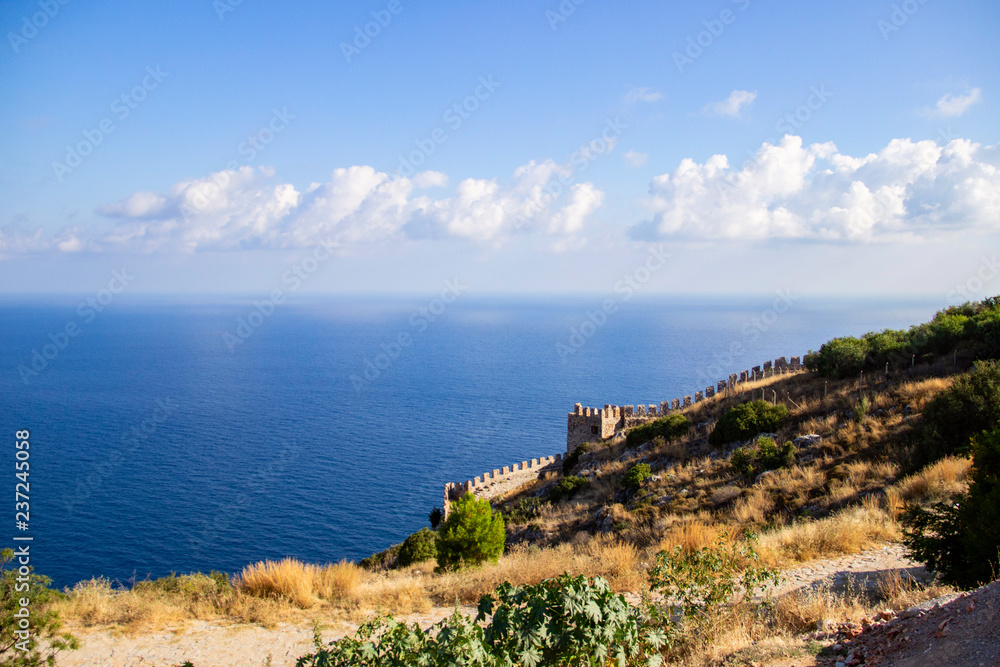Landscape with a view of the walls of the fortress of Alanya. Asia,Turkey, Alanya peninsula, Antalya district. Landscape with a view of the walls of the fortress of Alanya. Asia,Turkey, Alanya peninsula, Antalya district.