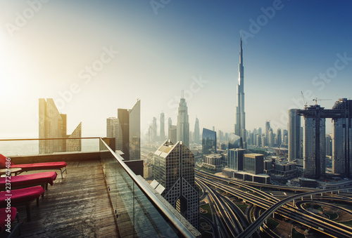 Dubai skyline in the morning sunrise, panoramic aerial top view to downtown city center landmarks from famous viewpoint rooftop, United Arab Emirates