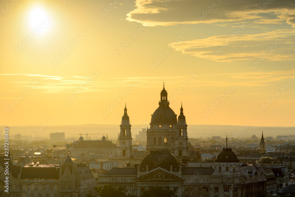 Backlit St. Stephen's Basilica against Budapest skyline 