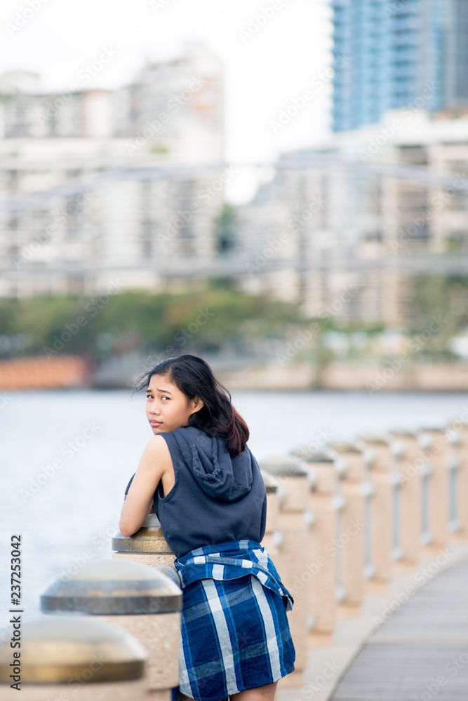 Thai girl poses for picture in Brisbane, Australia. Brisbane is one of the Australia's tourist destination points.