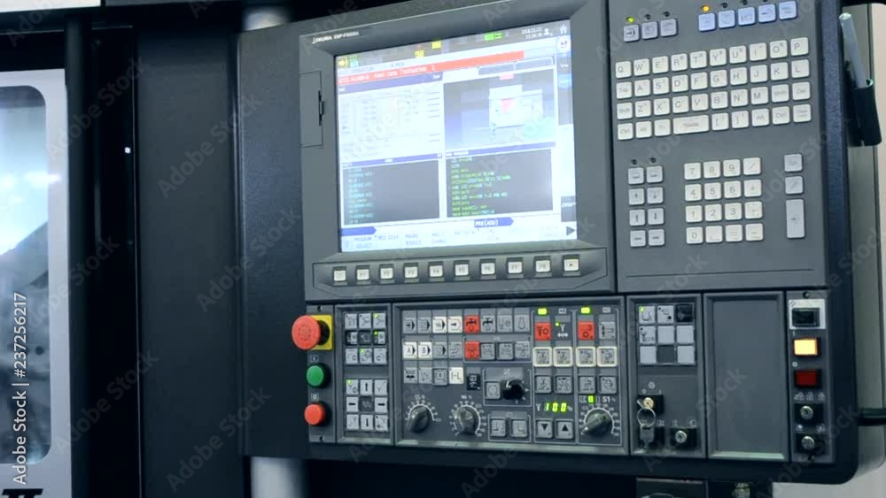 Work control panel an industrial machine at the factory close-up. Industrial machinery, production aggregation and equipment mechanical automaton. Heavy machinery Work control panel an industrial machine at the factory close-up. Industrial machinery, production aggregation and equipment mechanical automaton. Heavy machinery