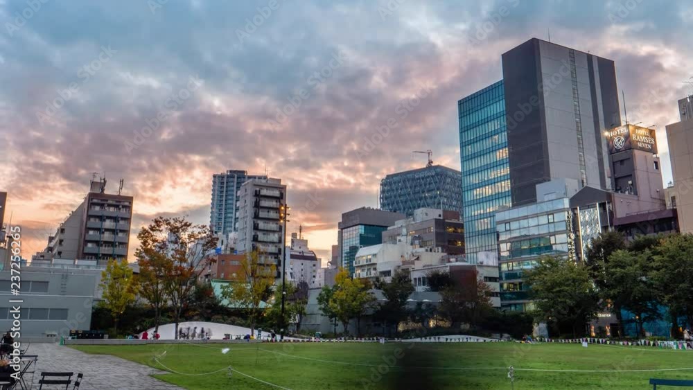 Timelapse shot of sunsetting at Ikebukuro Park, beautiful sky and city as background, Ikebukuro Tokyo Japan, October 2018. Timelapse shot of sunsetting at Ikebukuro Park, beautiful sky and city as background, Ikebukuro Tokyo Japan, October 2018.