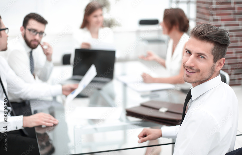 businessman and business team sitting at the Desk businessman and business team sitting at the Desk