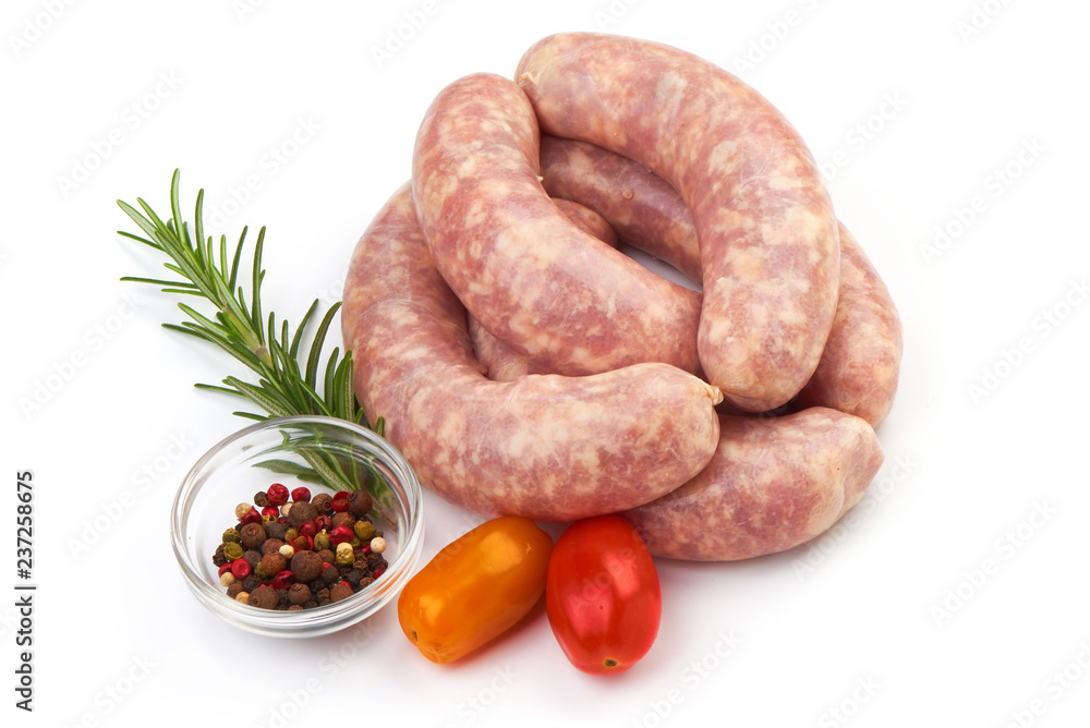 Fototapeta premium Fresh Sausages, Spiral Sausages with herbs and spices, isolated on a white background. Close-up