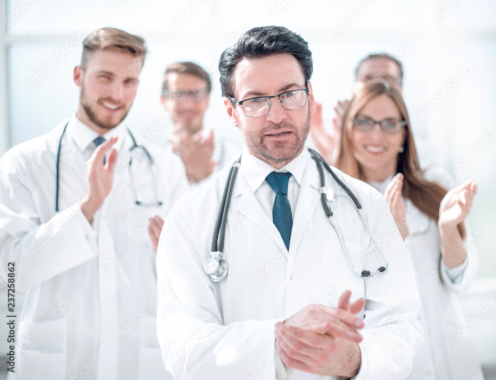 successful doctor, accepting congratulations from colleagues successful doctor, accepting congratulations from colleagues