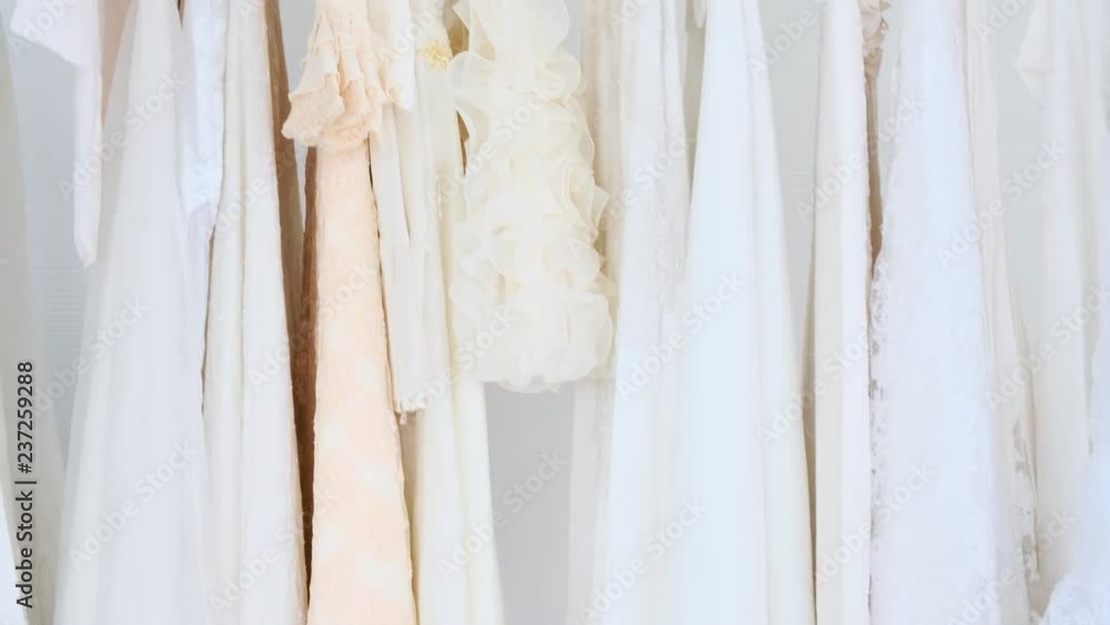 Background of cloth rack full of wedding dresses. Gimbal shot. Background of cloth rack full of wedding dresses. Gimbal shot.