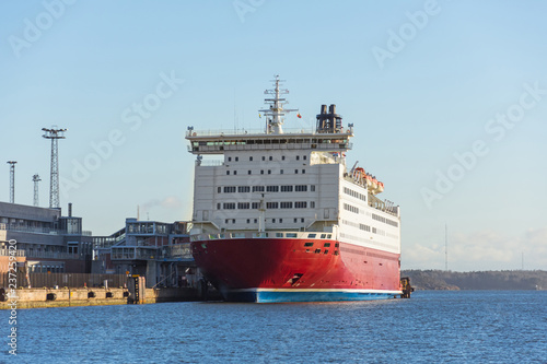 Modern passenger ocean liner docked in port.