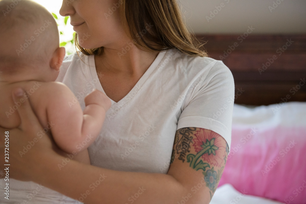 baby in mother's arms baby in mother's arms