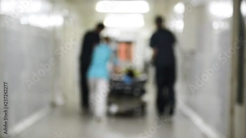 Emergency Department: Doctors, Nurses and Surgeons Move Seriously Injured Patient. Blurred video