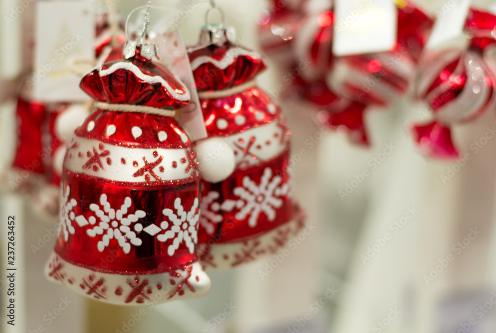 New year and christmas background. Shiny red decorations in shape of bag with ornament for christmas tree. Copy space.