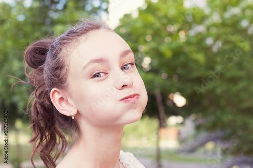 Fényképezés Young girl puffing out her cheeks