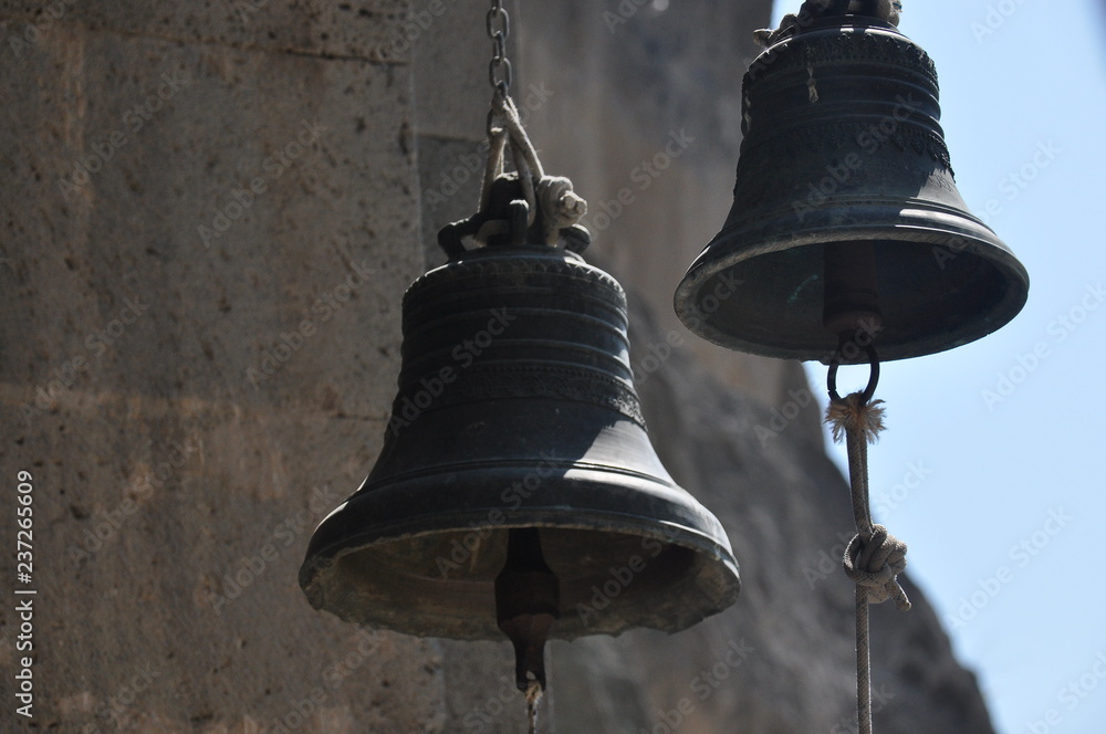Obraz premium Mass bells in the old rock town of Vardzia in Georgia.