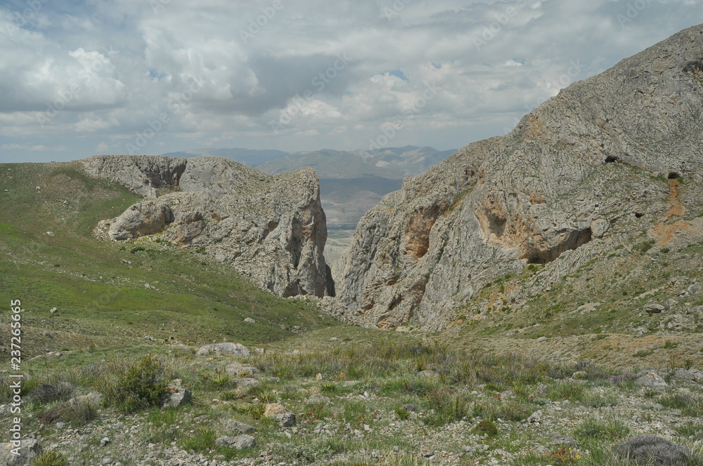 Taurus Mountains. Turkey. Steep cliffs and gorge. Snow-capped peaks.