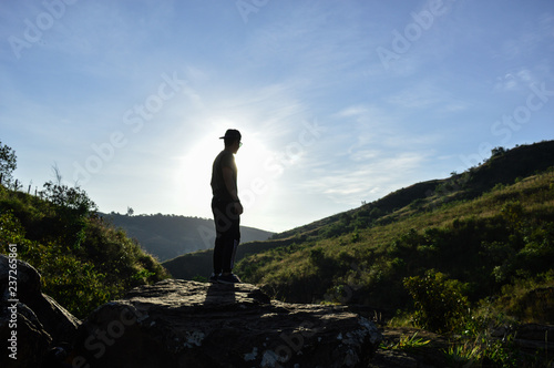 man standing on a rock in nature
