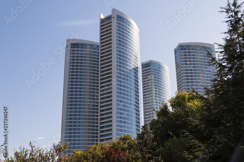 real estate and mortgage investment. Being an easy way homeowner.modern building skyscrapers.Modern Office Buildings © Fertas