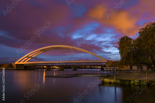 Fototapeta Naklejka Na Ścianę i Meble -  Railway bridge over Martwa Wisla river at night in Gdansk. Poland Europe.