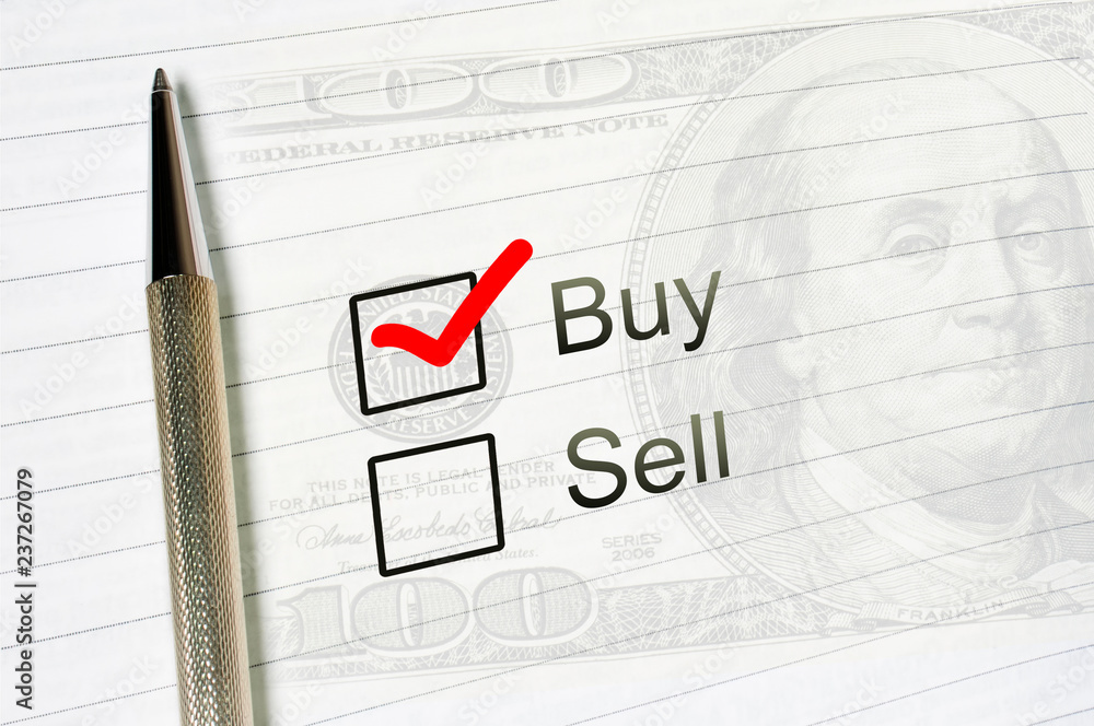 buy choice or sell, marked check box with a pen on lined paper dollar background. Trade concept buy choice or sell, marked check box with a pen on lined paper dollar background. Trade concept