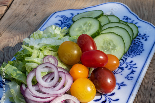 fresh salad served on table