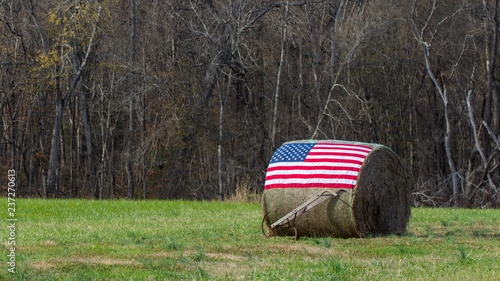 American flag on bale of hay photo