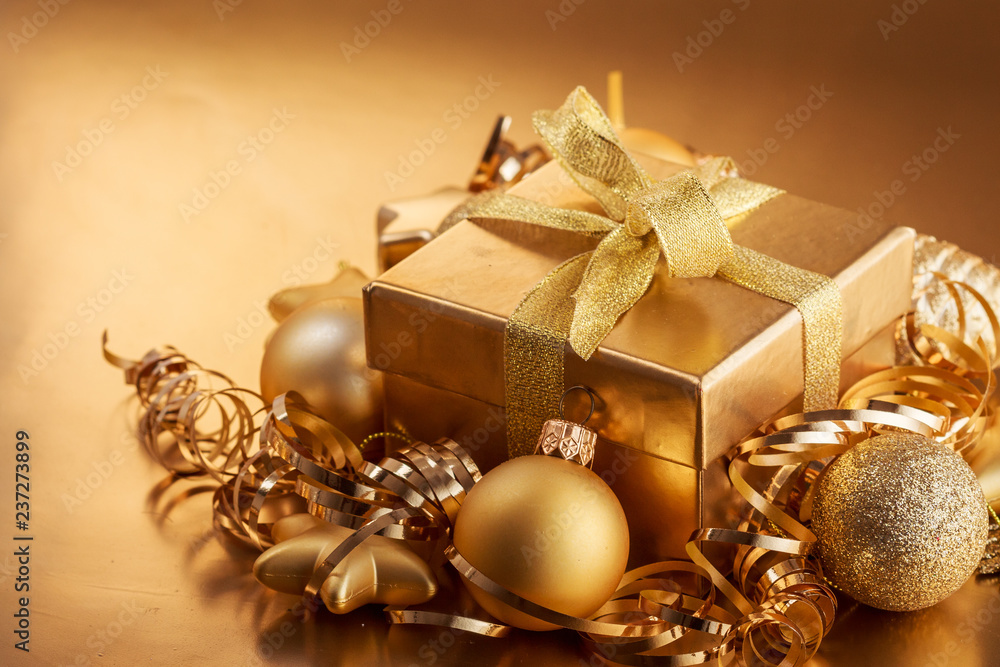 Christmas composition of Christmas tree toys on a blurred gold background Christmas composition of Christmas tree toys on a blurred gold background