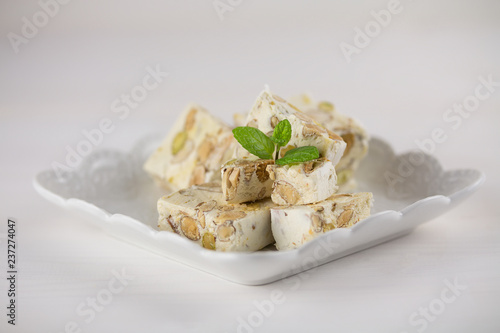 Italian torrone or nougat with almonds and pistachios from Apulia, traditional christmas sweets
