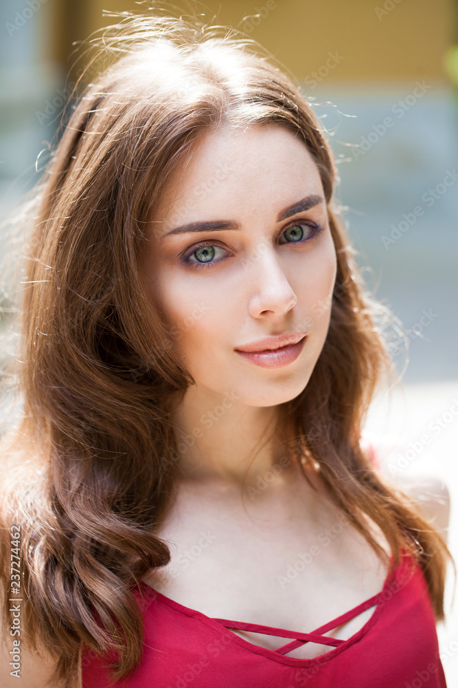 Closeup portrait of a young beautiful girl on summer background Closeup portrait of a young beautiful girl on summer background