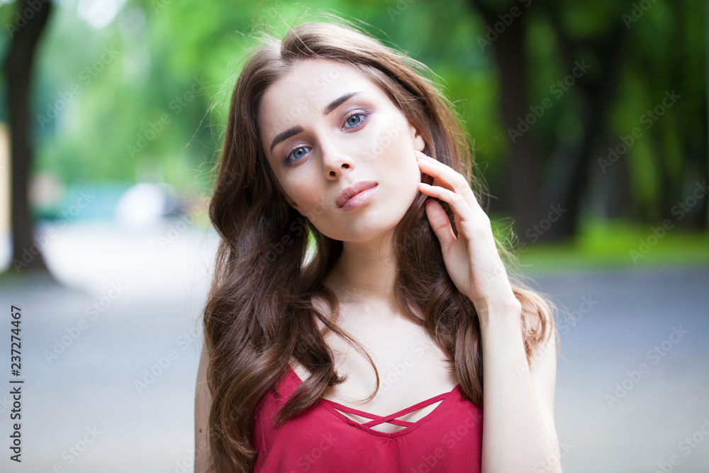 Closeup portrait of a young beautiful girl on summer background Closeup portrait of a young beautiful girl on summer background