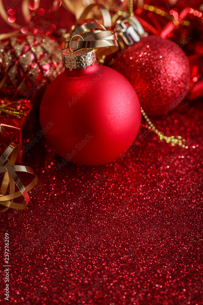 Christmas composition of Christmas tree toys on a blurred red background Christmas composition of Christmas tree toys on a blurred red background