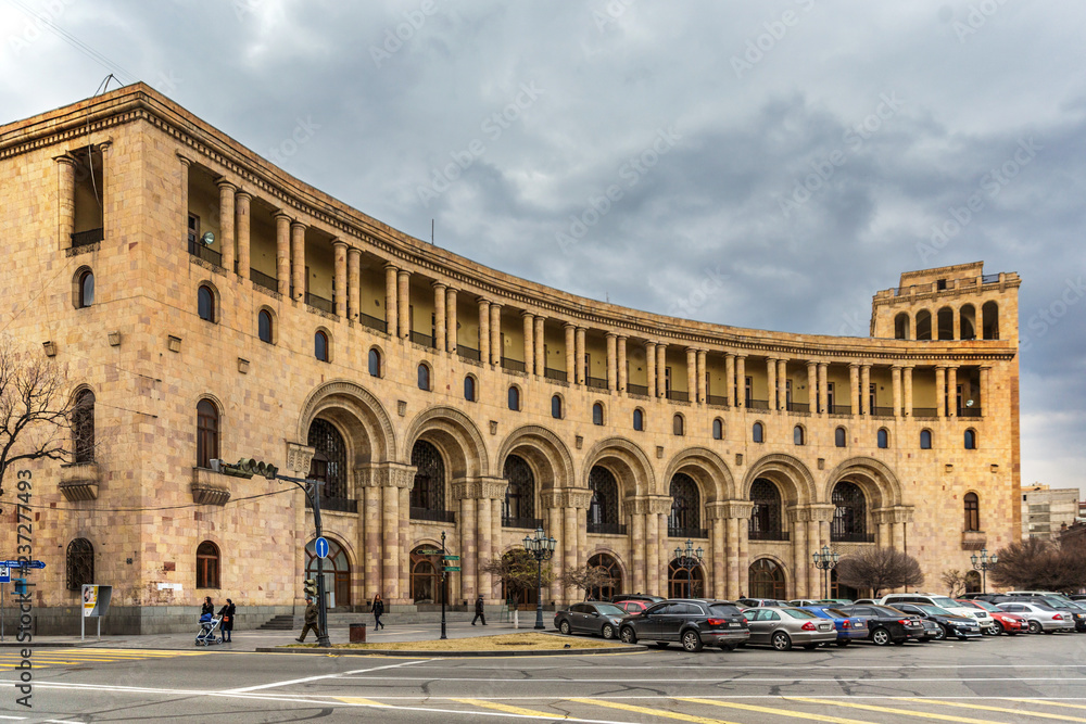 Yerevan, Armenia - Jan 18th 2018 - Cars parking in front of a big buildings in downtown Yerevan the capital of Armenia