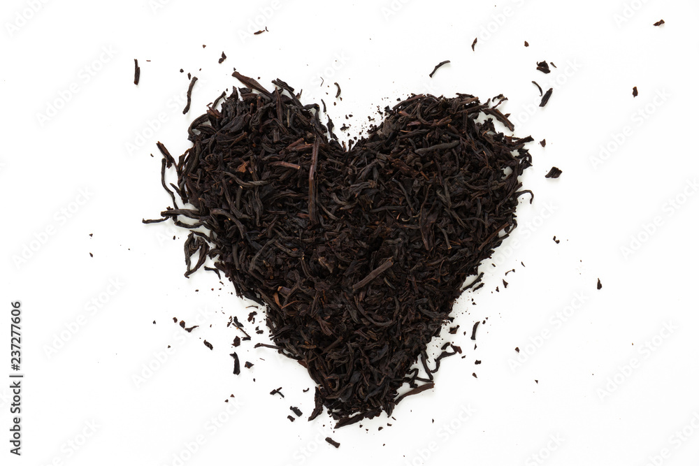 Heart made of black dry tea, on white background. Heart made of black dry tea, on white background.