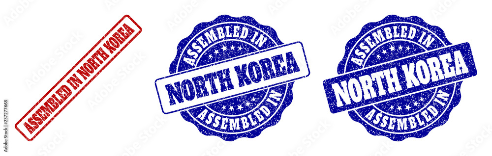 ASSEMBLED IN NORTH KOREA grunge stamp seals in red and blue colors. Vector ASSEMBLED IN NORTH KOREA marks with grainy surface. Graphic elements are rounded rectangles, rosettes, circles and text tags. ASSEMBLED IN NORTH KOREA grunge stamp seals in red and blue colors. Vector ASSEMBLED IN NORTH KOREA marks with grainy surface. Graphic elements are rounded rectangles, rosettes, circles and text tags.