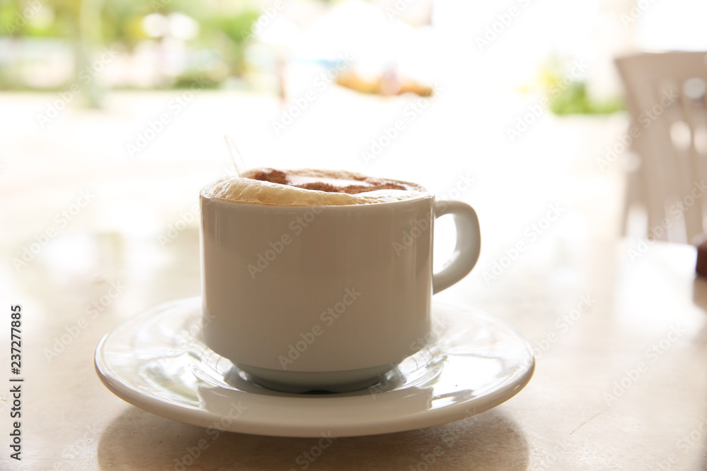 cup of cappuccino on the table