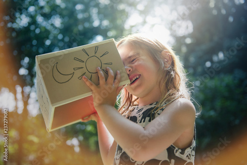 Little girl viewing solar eclipse photo