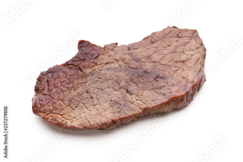 Grilled beef steaks with spices isolated on white background.
