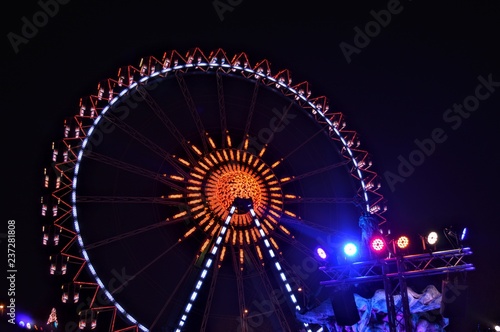Ferry wheel in Christmas market full with lights colorful