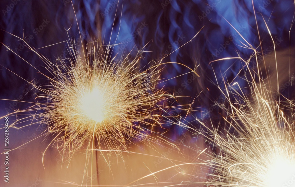 Fototapeta premium new year sparkler, glitter on gold