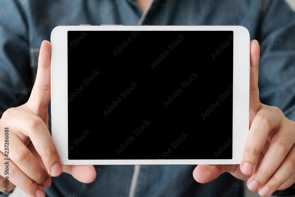 Man hands using tablet with blank screen for mock up template background, business technology and lifestyle background concept Man hands using tablet with blank screen for mock up template background, business technology and lifestyle background concept
