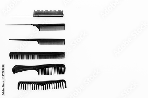 female hairdresser desk with accessories and combs on white background top view mockup