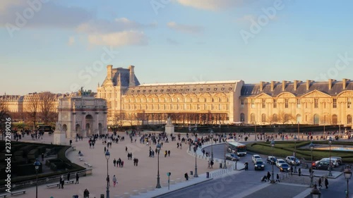 famous paris museum louvre pyramids square, france in sunset