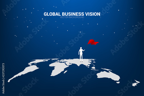 Silhouette of businessman with flag standing on world map. Business Concept of world target mission.