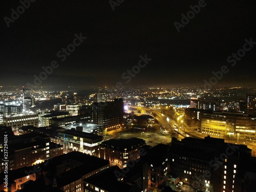 Aerial night time photo taken above the Leeds City Center at Christmas Time showing the Leeds Town Hall and buildings and roads around West Yorkshire. © Duncan