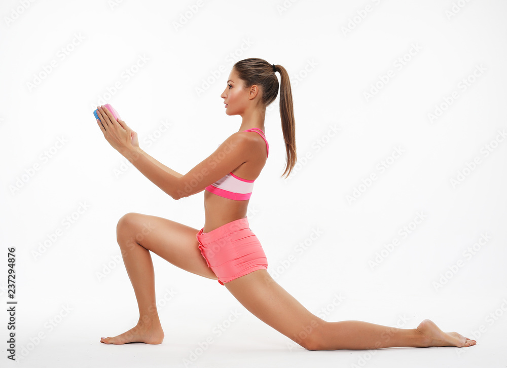 Fototapeta premium Young woman practicing yoga, working out, wearing sportswear, st