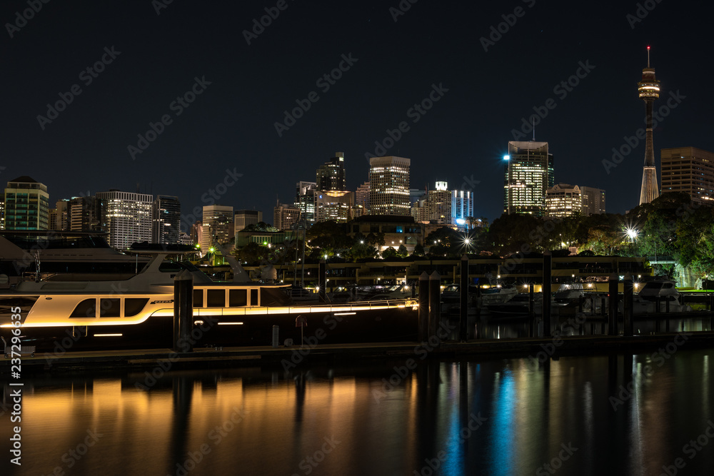 A cruising yacht sits at Sydney's Woolloomooloo Finger Wharf with the city in the background A cruising yacht sits at Sydney's Woolloomooloo Finger Wharf with the city in the background